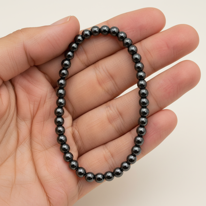 Hematite Stretch Bracelet, 4mm, held in hand
