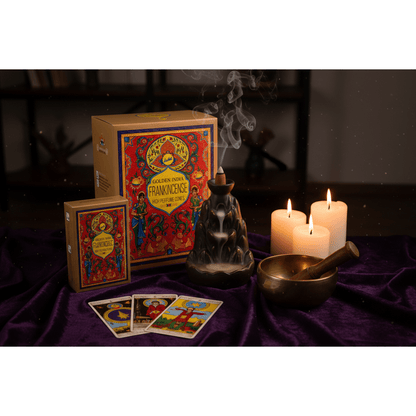 Frankincense backflow cone with cascading smoke beside tarot cards and a singing bowl on dark purple velvet