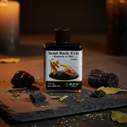 Send Back Evil Oil 4 dram bottle on a dark slate altar surrounded by black tourmaline crystals and dried herbs in candlelight