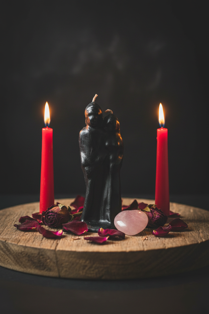 6" Marriage Black Candle on wooden altar tray flanked by red taper candles with rose quartz heart and red rose petals