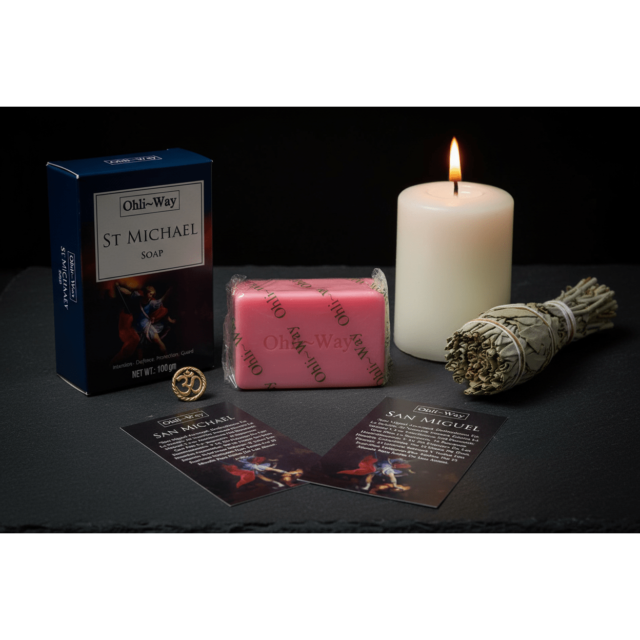 St. Michael Protection Soap set with soap bar, box, prayer cards and Om charm on dark slate with candle and sage