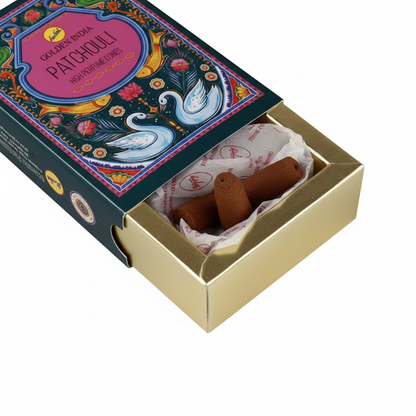 Inside the Golden India Patchouli box with paper sleeve slid up revealing gold wooden inner tray and cones
