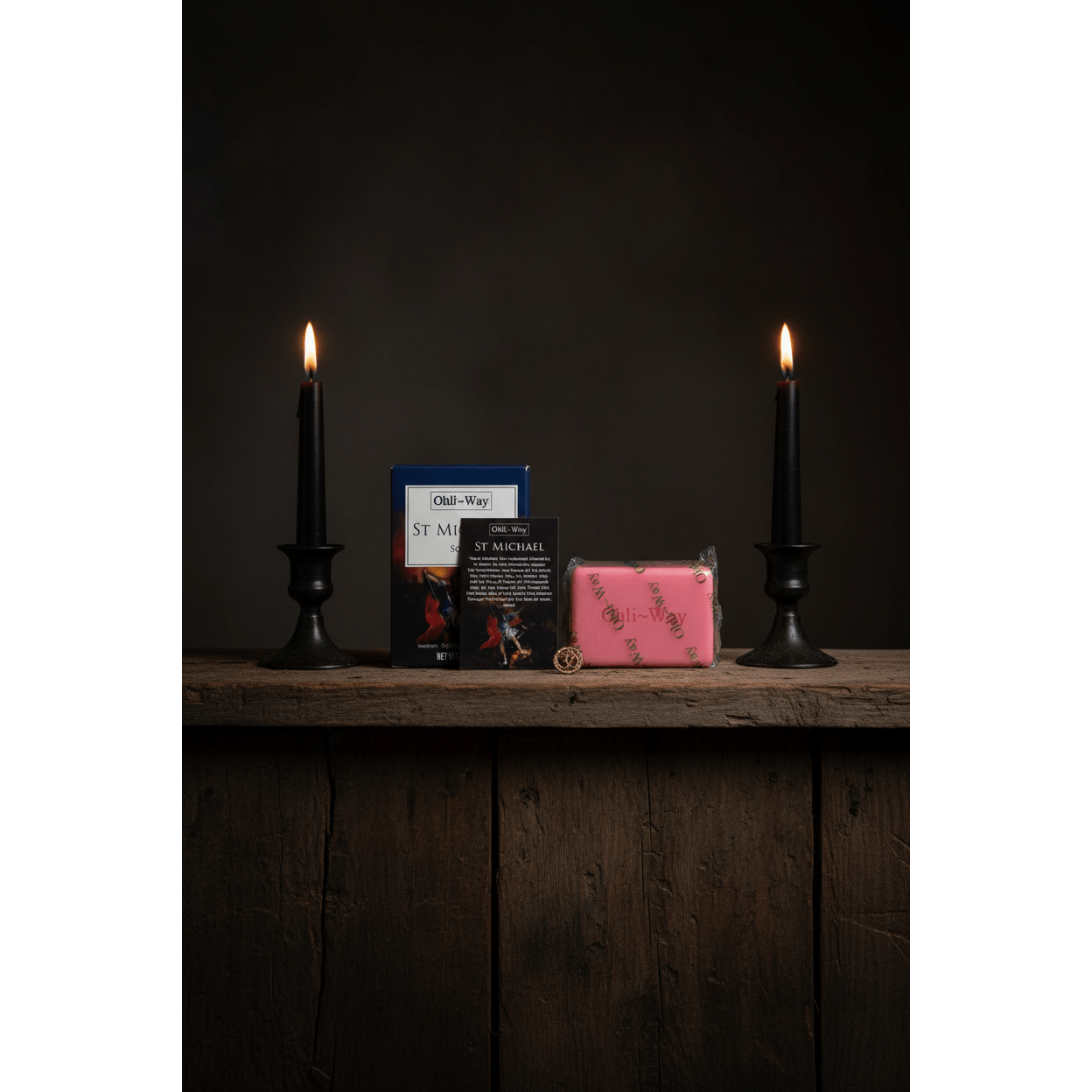 St. Michael Protection Soap set on rustic wooden altar shelf with lit taper candles