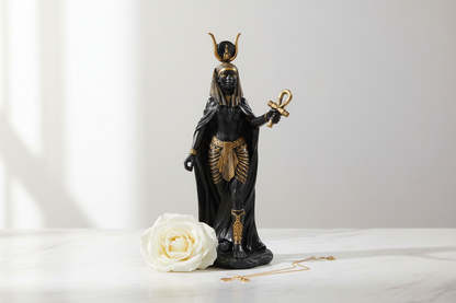 Hathor Statue 11" on white marble surface with white rose and gold chain, minimalist luxury setting