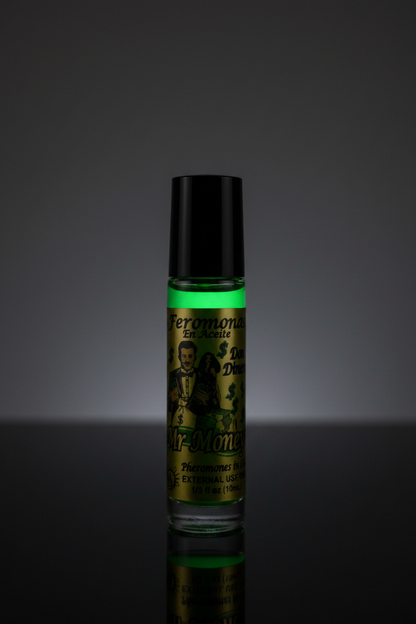 Mr. Money roll-on perfume on black reflective surface with dramatic green glowing light