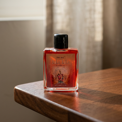 Photorealistic 1 oz Jala Jala Oil bottle on dark wooden surface, illuminated by warm natural light highlighting transparency and glass details.