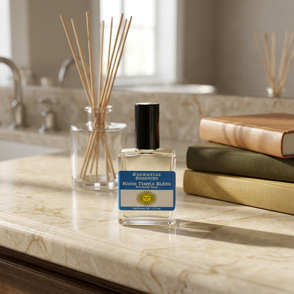 Full-body view of the small Mayan Temple perfume oil bottle on a polished marble vanity, illuminated with warm natural sunlight highlighting the delicate label.