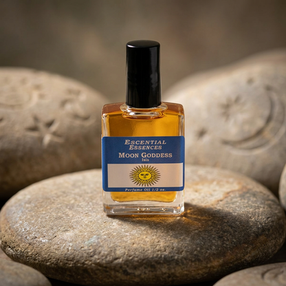 Close-up of Moon Goddess Isis perfume oil bottle on a natural stone surface, highlighting micro-texture and celestial themes for spiritual serenity.