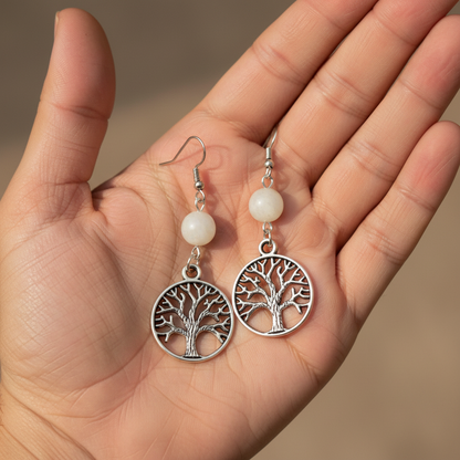 Moonstone Tree of Life Earrings, held in hand
