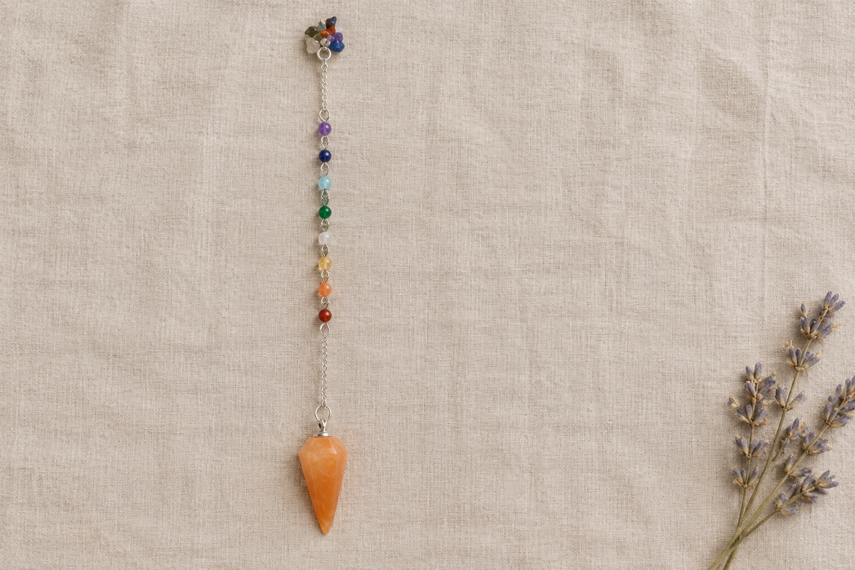 Orange pendulum flat lay