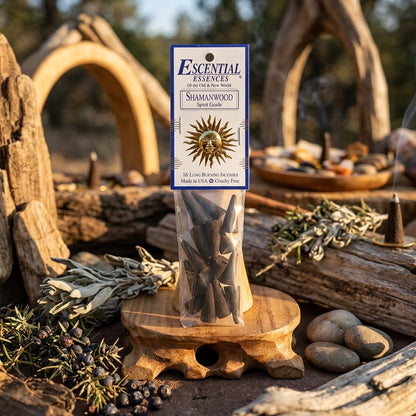 Small incense cone placed in outdoor sacred space, surrounded by herbs and stones, illuminated by golden hour light for grounding and ritual.