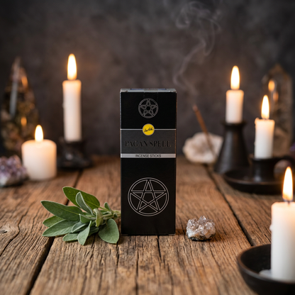Small box of 6 Pagan Spell Sree Vani incense sticks on a natural wooden altar surrounded by candles and sage leaves in a cozy sacred space.