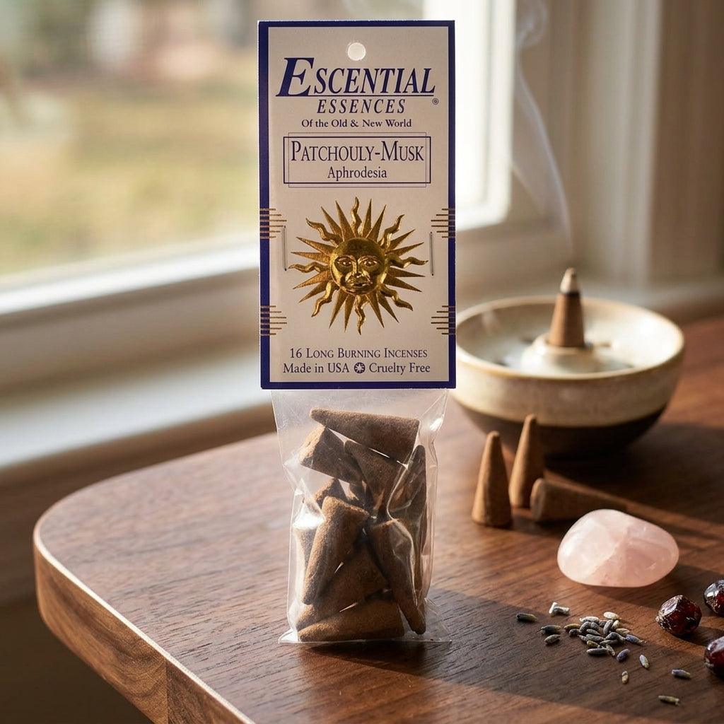 Small Patchouly Musk incense cone placed on dark wood, ideal for intimate rituals and attraction enhancement.