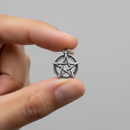 Pentacle Pendant, Sterling Silver, 5/8 Inch, held in hand
