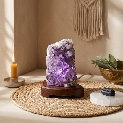 Professional scene with amethyst druse lamp, ritual accessories, and natural lighting creating a spiritual calming atmosphere