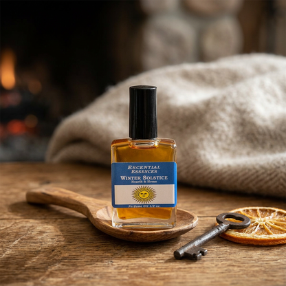 Photorealistic close-up of 1/2oz Winter Solstice essential oil bottle on rustic wood with soft natural light, highlighting glass texture and label detail.
