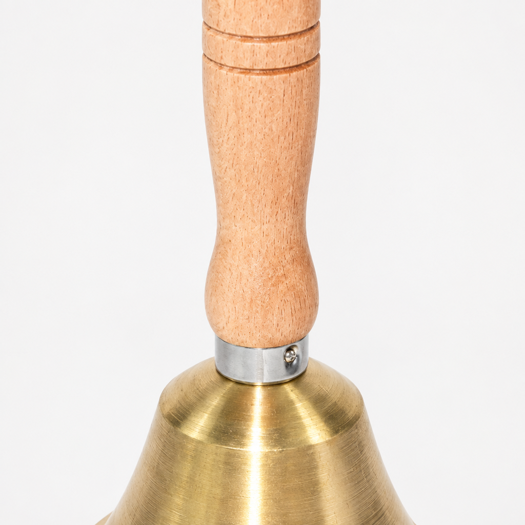 Wooden handle and brass bell detail