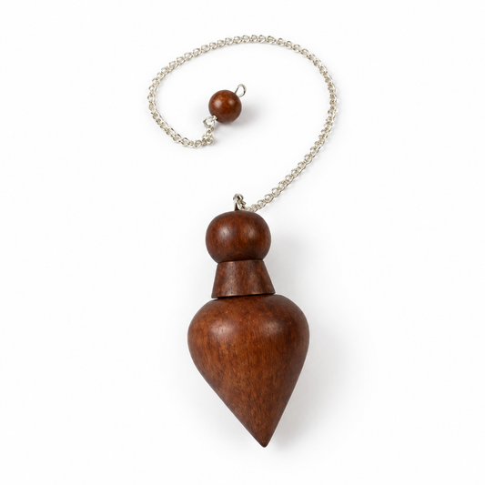 Wooden pendulum on white